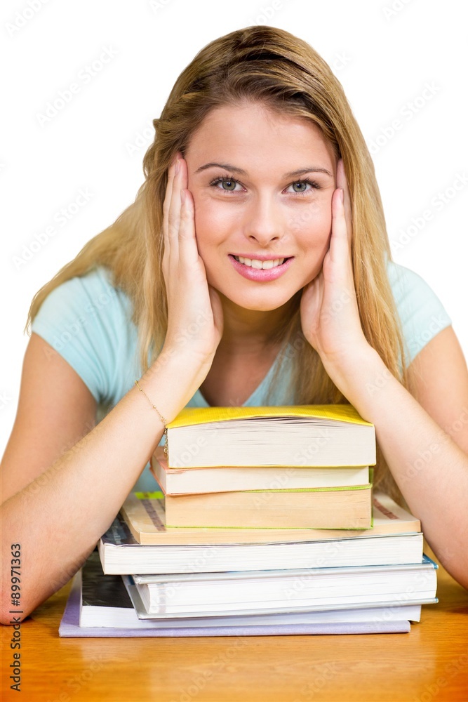 Composite image of portrait of female student in library Composite image of portrait of female student in library