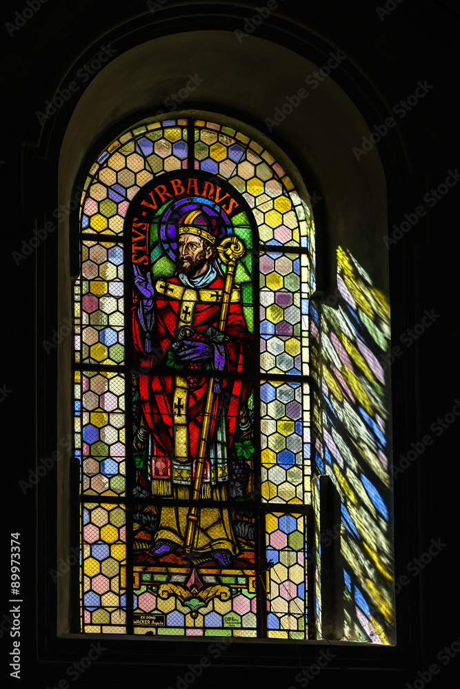 Sun light through the leaded pane in old majestic church