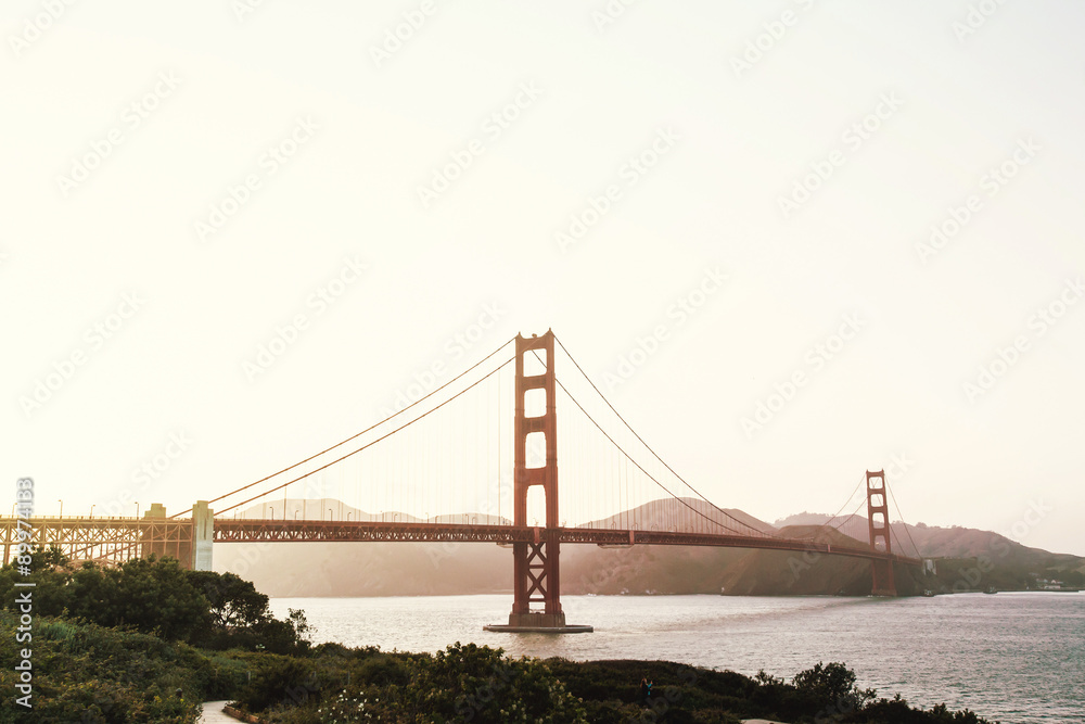 Naklejka premium Beautiful sunset view on Golden Gate bridge in San Francisco, California, USA