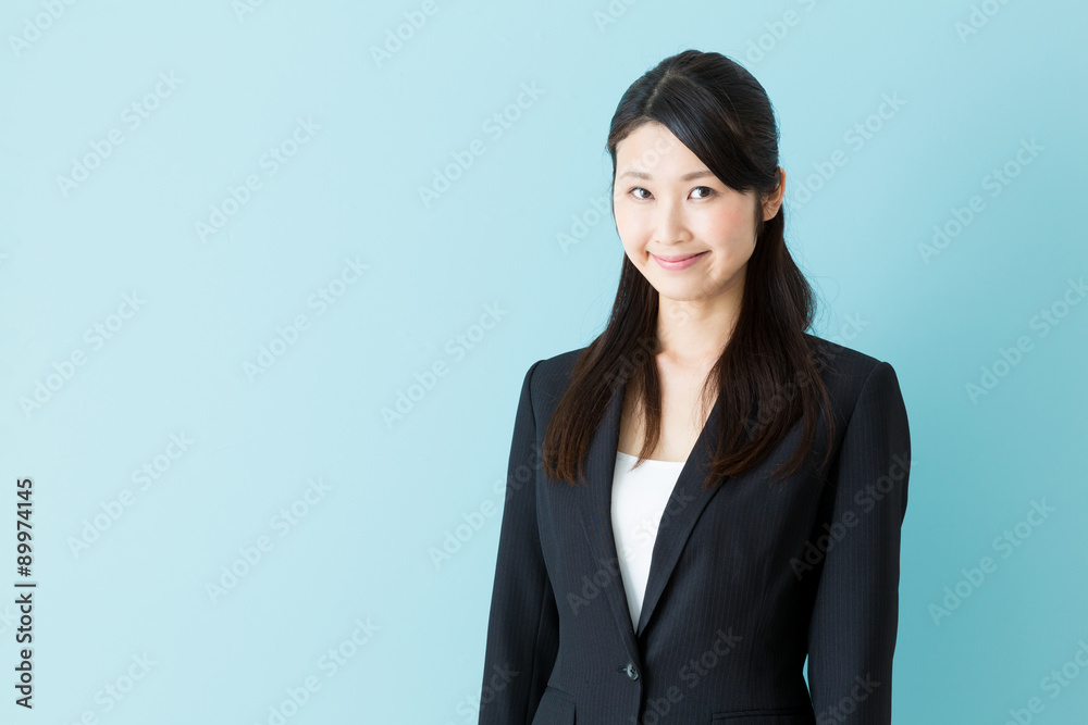 portrait of asian businesswoman on blue background portrait of asian businesswoman on blue background