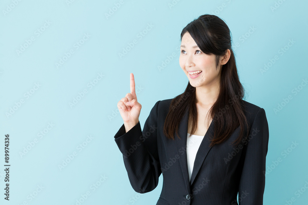 portrait of asian businesswoman on blue background portrait of asian businesswoman on blue background
