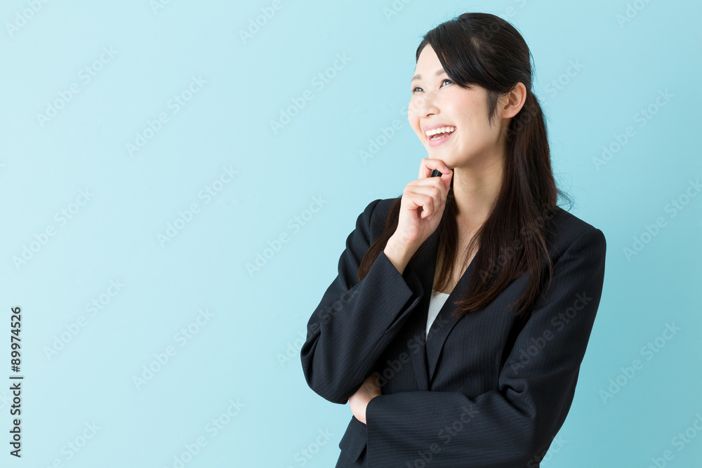 portrait of asian businesswoman on blue background portrait of asian businesswoman on blue background
