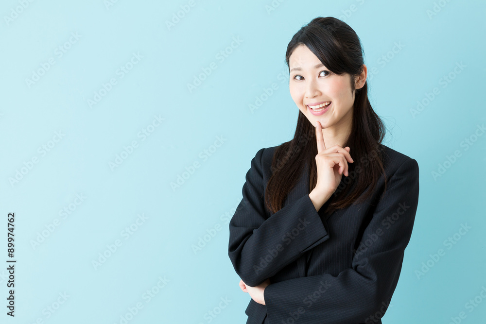portrait of asian businesswoman on blue background portrait of asian businesswoman on blue background