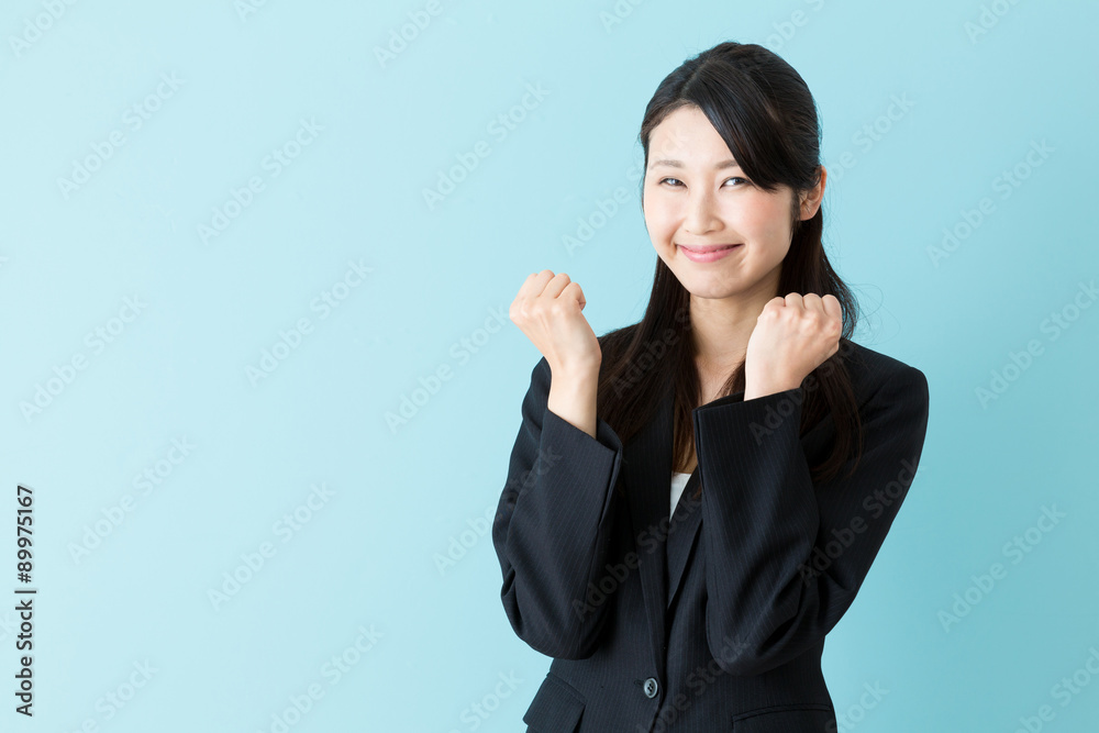portrait of asian businesswoman on blue background portrait of asian businesswoman on blue background
