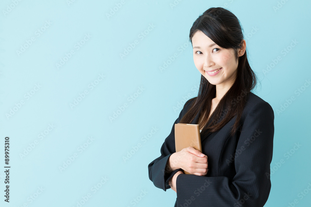 portrait of asian businesswoman on blue background portrait of asian businesswoman on blue background