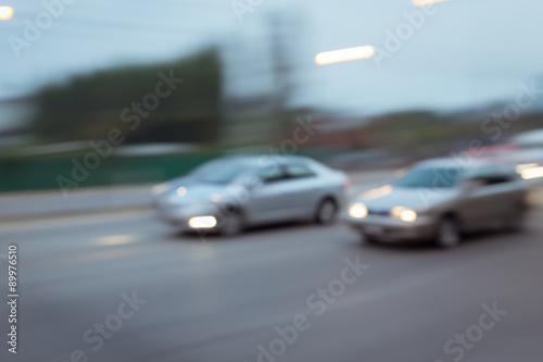 Fototapeta Naklejka Na Ścianę i Meble -  car driving on road with traffic jam in the city, abstract blurred