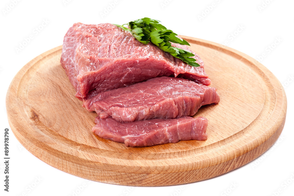 Meat on a cutting board on white background. Meat on a cutting board on white background.