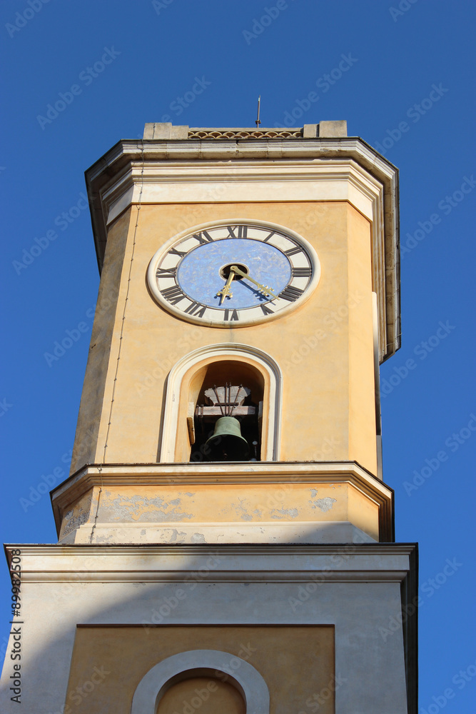Church Tower in Eze. Blue sky background