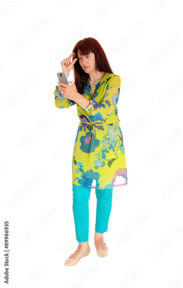 Businesswoman looking at cell phone. Businesswoman looking at cell phone.