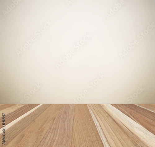 Blurred brown cement wall and perspective wood background