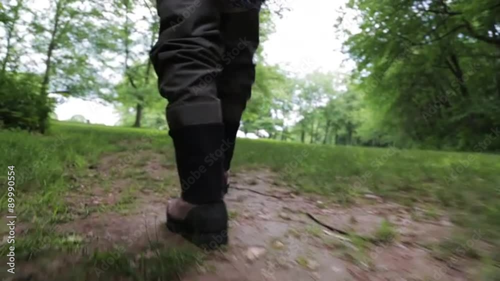 Fisherman walks in the woods. Steadicam tracking closeup. Fisherman walks in the woods. Steadicam tracking closeup.
