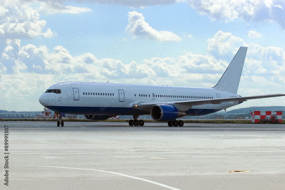 large passenger plane was taxiing for take-off in summer large passenger plane was taxiing for take-off in summer