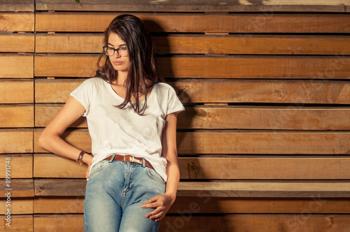 Pretty hipster female model wearing eyeglasses