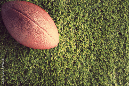 Vintage football over grass