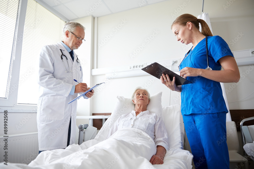 doctor and nurse visiting senior woman at hospital doctor and nurse visiting senior woman at hospital