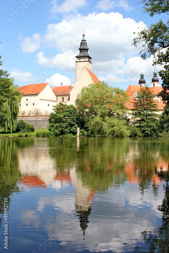 fairy tale castle and its mirror image on the surface of the pond, Telc, Moravia, Czech republic