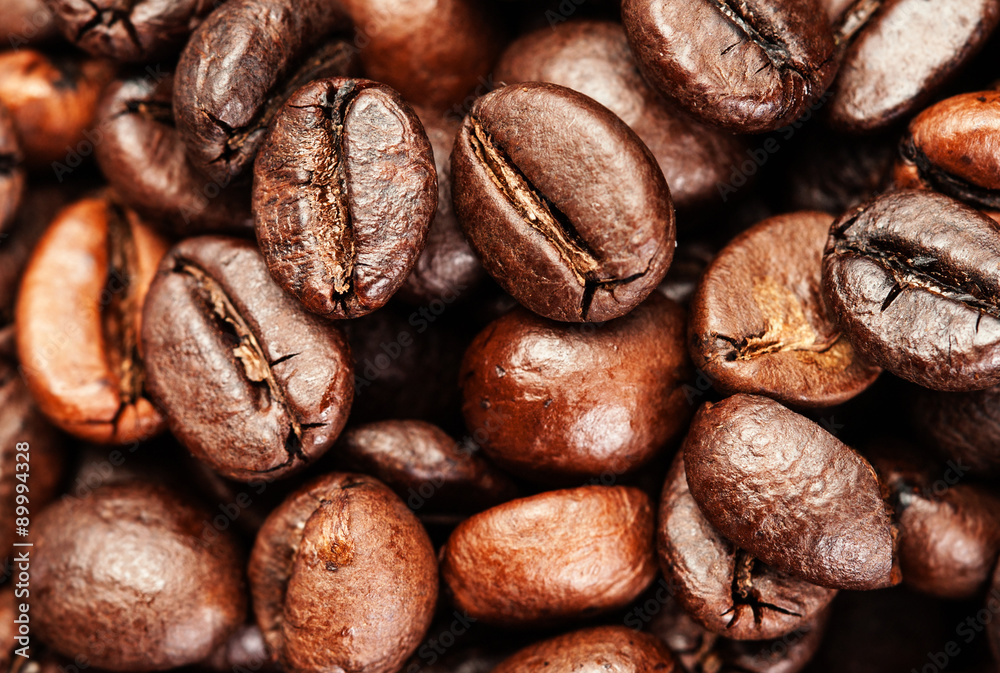 Naklejka premium Roasted coffee beans, can be used as a background. Coffee beans