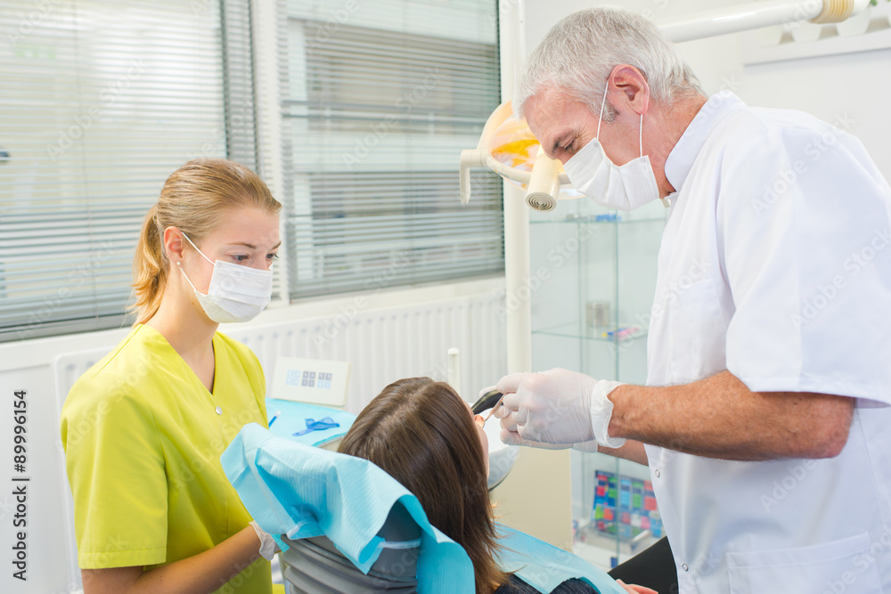 Fototapeta premium Busy dentist with a patient