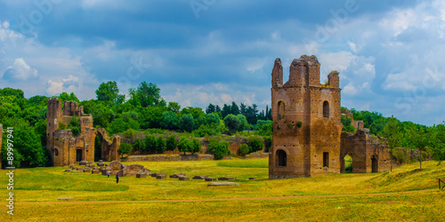 Photography via appia used to be important trade route for antique merchants in ancient rome, nowadays leads thourgh fields among ancient gates, ruins and modern farms