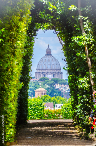 Photography View through keyhole of maltese knights portal with saint peters basilica at the