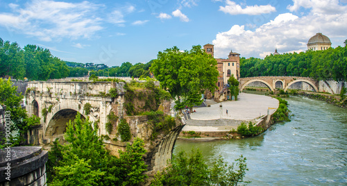 isola tiberina is the biggest island of tibera river in rome. This small island is attractive touristic spot on the way to trastevere district. photo