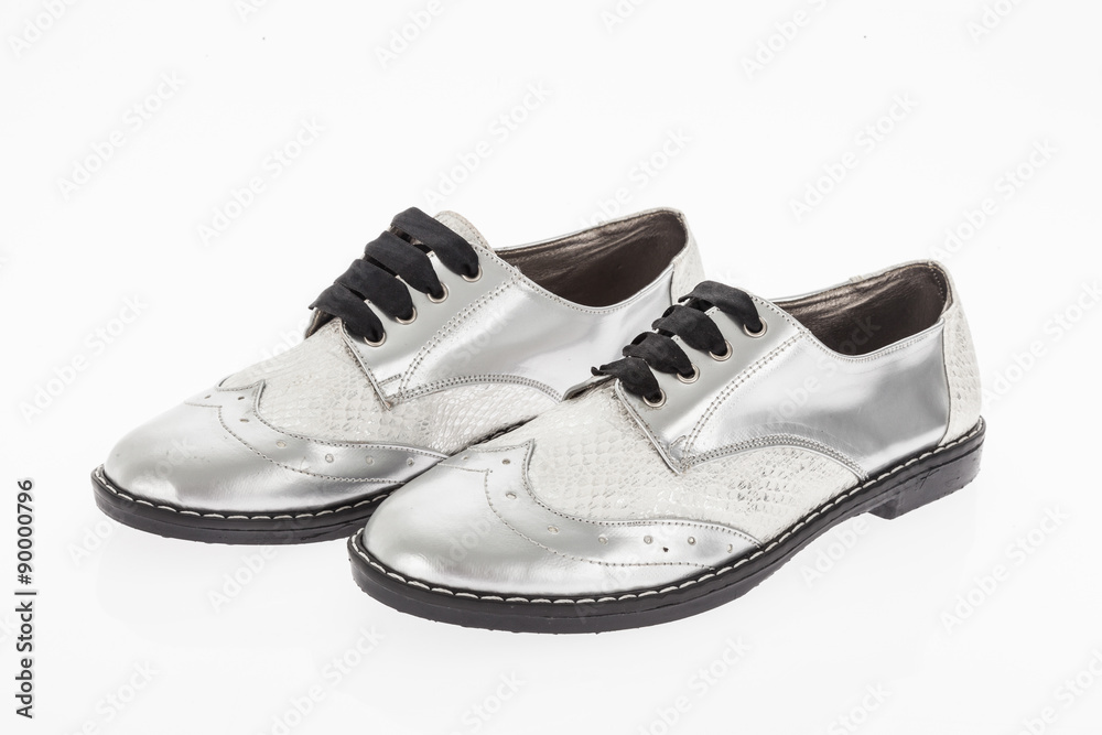 shoe made of grey leather with laces for women on white background