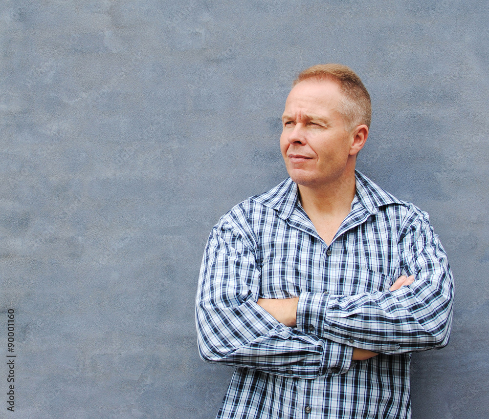 Portrait of attractive man at a blue wall Portrait of attractive man at a blue wall