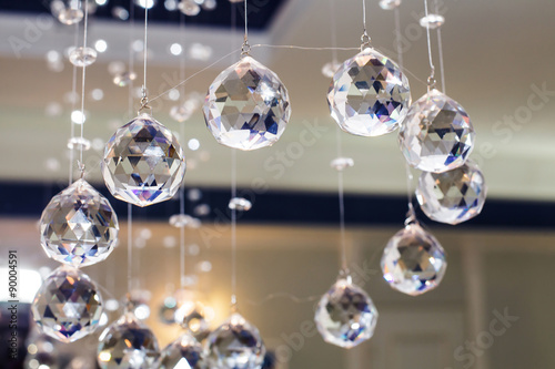 Balls faceted glass. Decorative pendant in the balls on the ceiling. The interior halls and rooms. The design of the space. Game and luchistoi faces. The celebration and decoration.