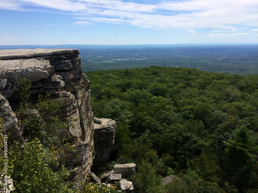 Massive rocks and view to the valley at Minnewaska State Park Reserve Upstate NY during summer time Massive rocks and view to the valley at Minnewaska State Park Reserve Upstate NY during summer time