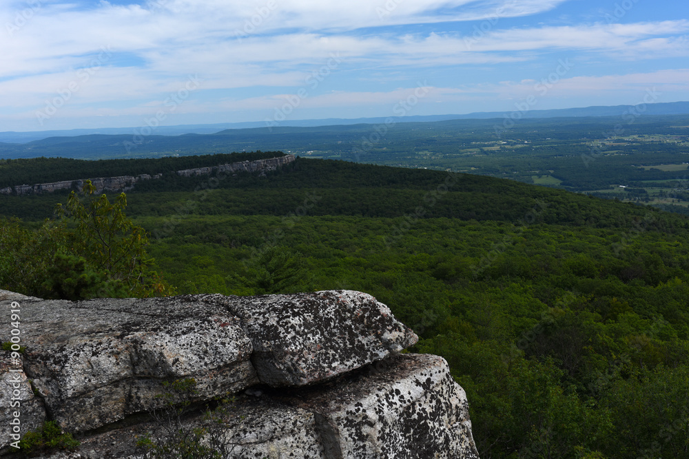 Massive rocks and view to the valley at Minnewaska State Park Reserve Upstate NY during summer time