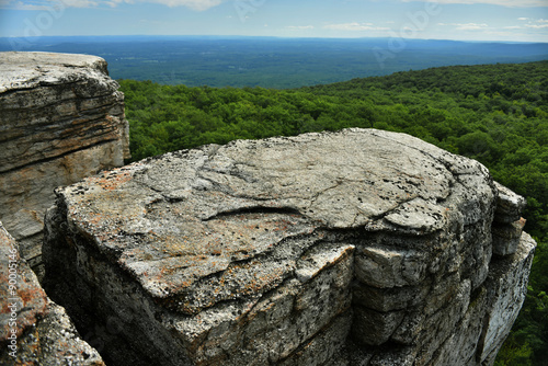 Massive rocks and view to the valley at Minnewaska State Park Reserve Upstate NY during summer time photo