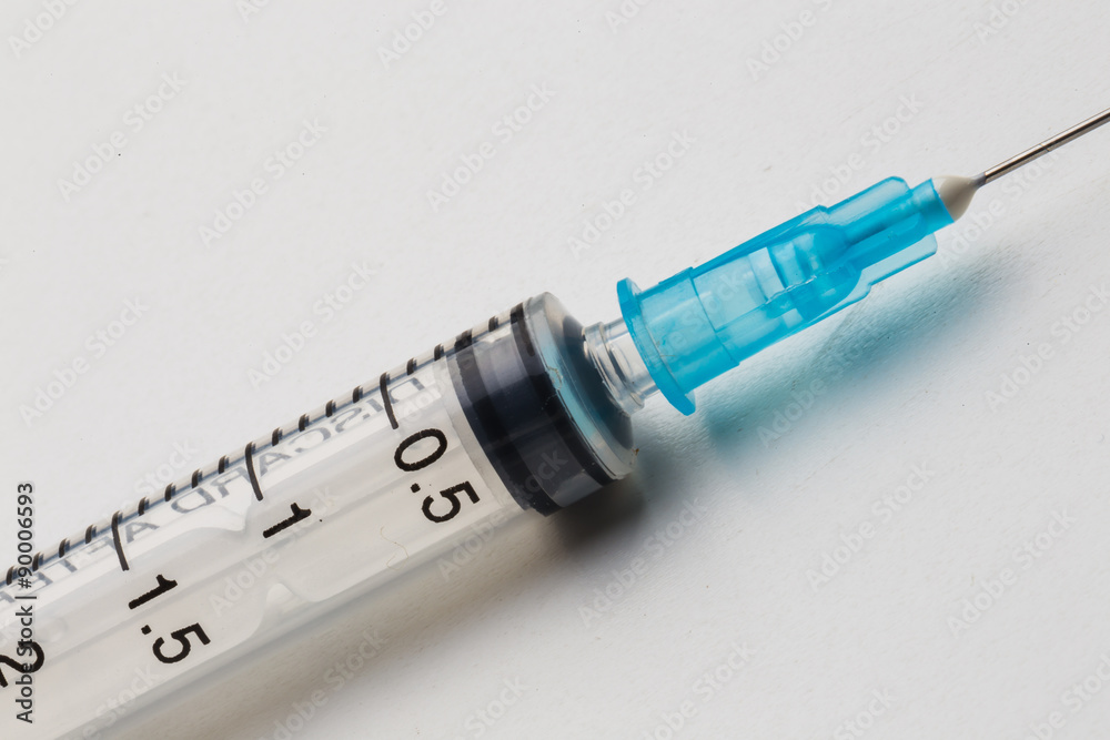 Disposable syringe in the row Disposable syringe in the row
