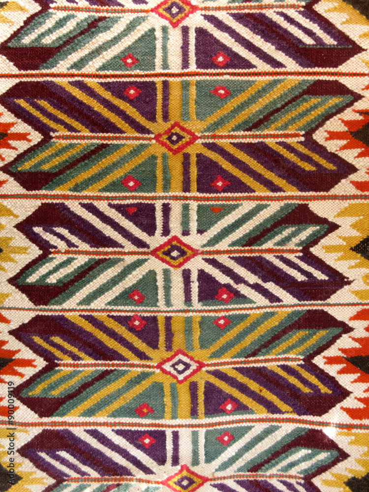 Fototapeta premium Close up of a hanged colourful handmade traditional wool rug