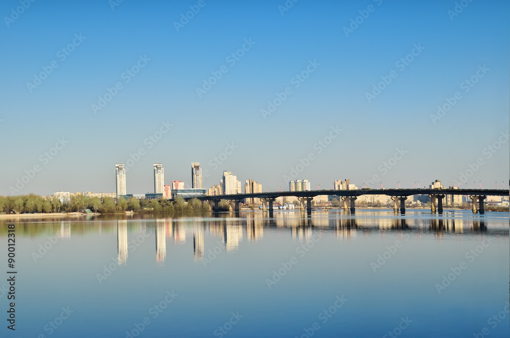 Bridge across the river against the background of the city