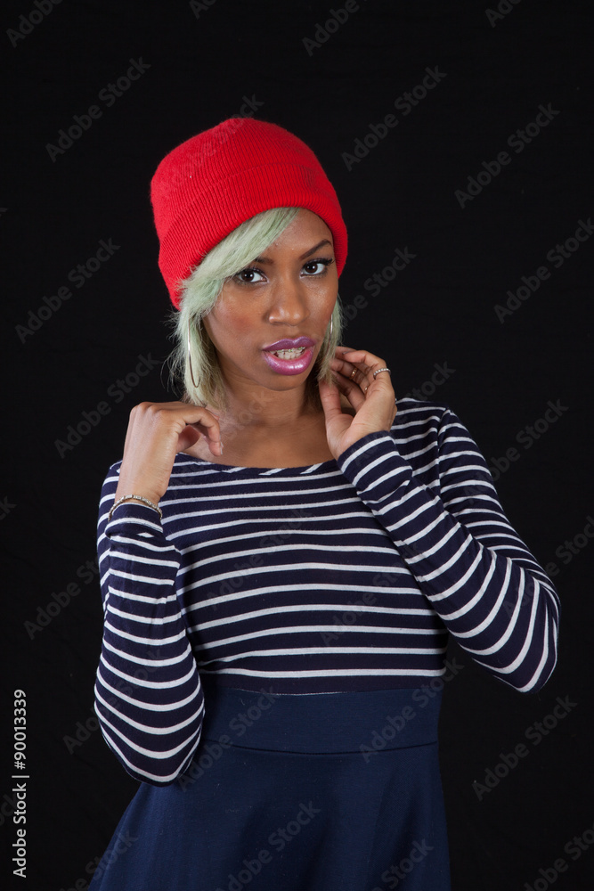 Pretty woman in red hat looking thoughtful Pretty woman in red hat looking thoughtful