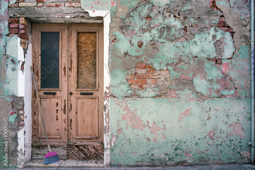 Old building with vintage door © maxoidos