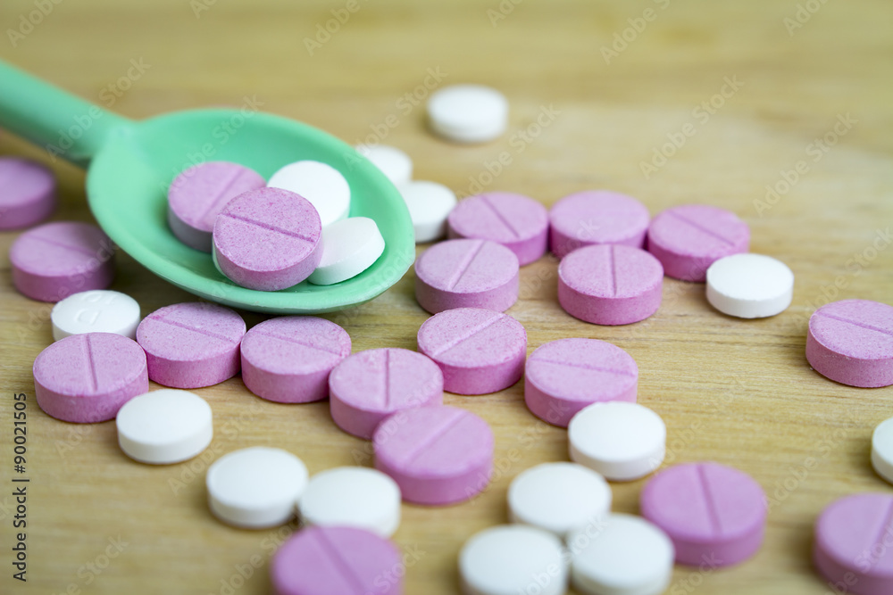 group of drugs on a spoon and wooden board group of drugs on a spoon and wooden board