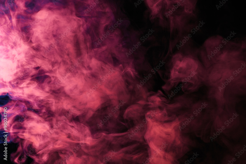 Abstract colored smoke hookah on a black background.