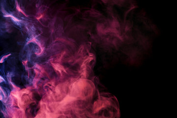 Abstract colored smoke hookah on a black background.