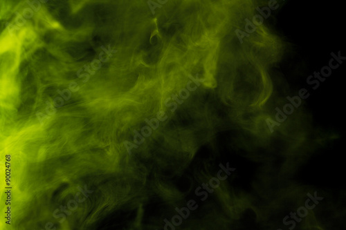 Abstract colored smoke hookah on a black background.