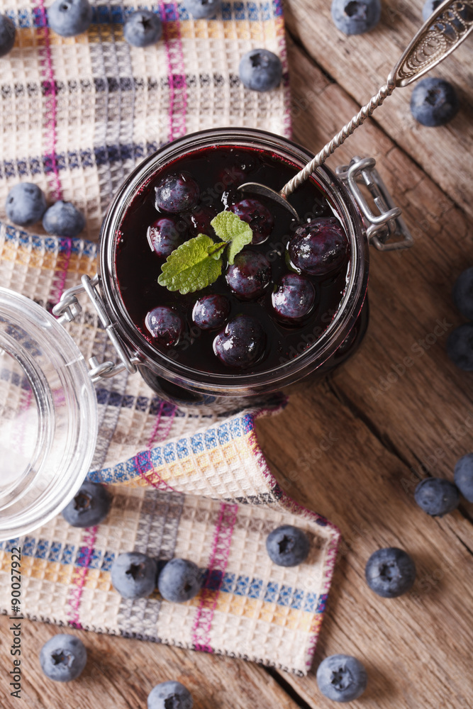 homemade blueberry jam in a glass jar. vertical top view
homemade blueberry jam in a glass jar. vertical top view