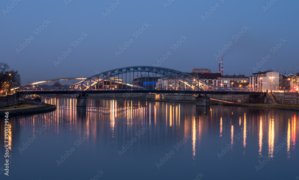 Krakow, Poland, bridges over Vistula river connecting Kazimierz and Podgorze districts in the night