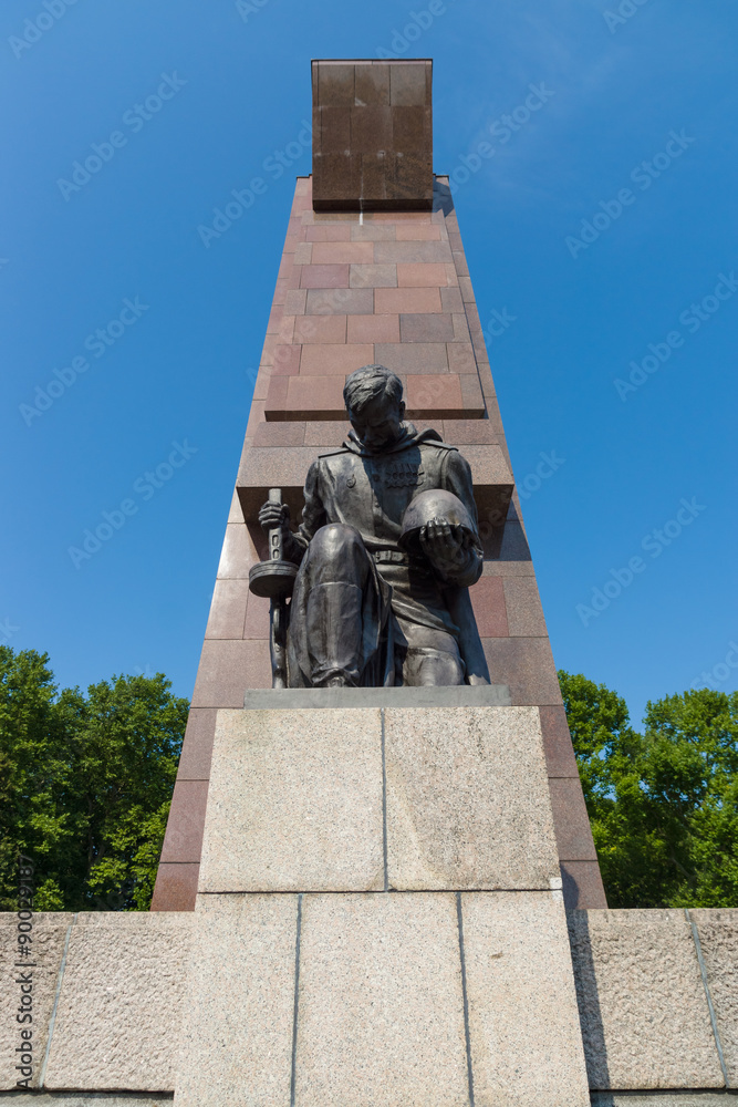 The Soviet War Memorial in Treptow Park. Sculpture of of a kneeling soldier. Berlin.