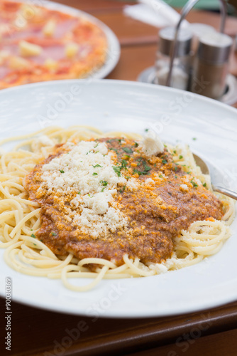 Spaghetti bolognese with parmesan cheese. Selective focus.