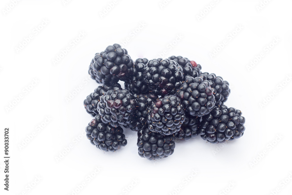 Fresh sweet blackberries with leaves isolated on white, selective focus Fresh sweet blackberries with leaves isolated on white, selective focus