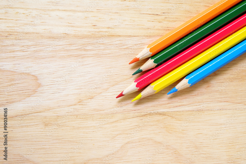 Color pencils on wood background Color pencils on wood background