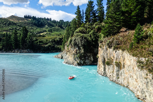 Jetboat on a turquoise glacial lake photo
