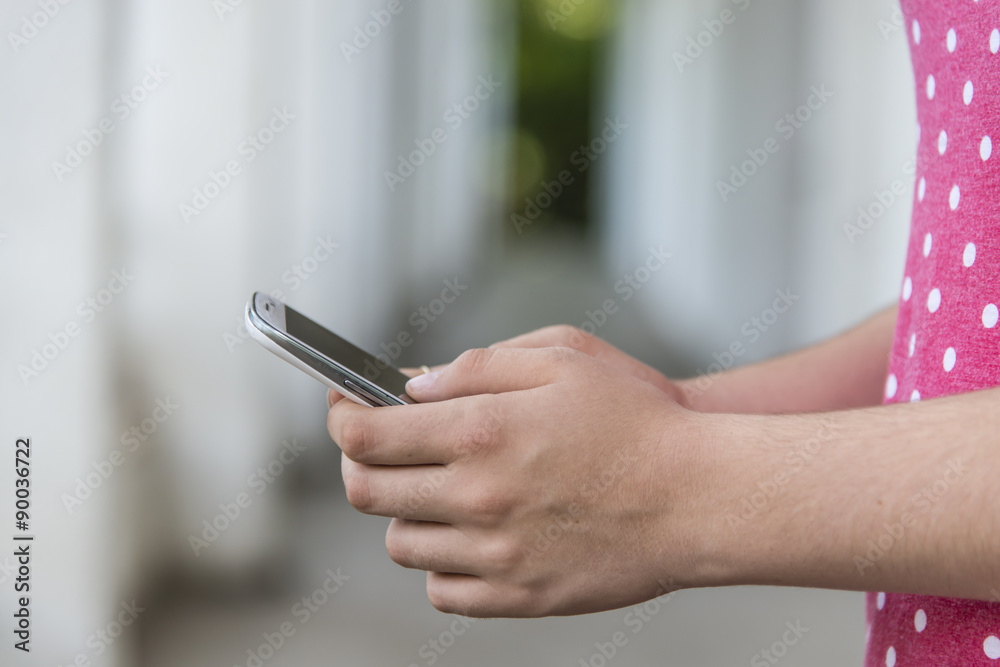 Teenage girl using mobile smart phone Teenage girl using mobile smart phone