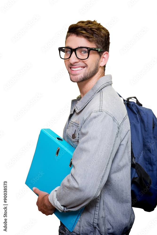 Composite image of student smiling at camera in library Composite image of student smiling at camera in library