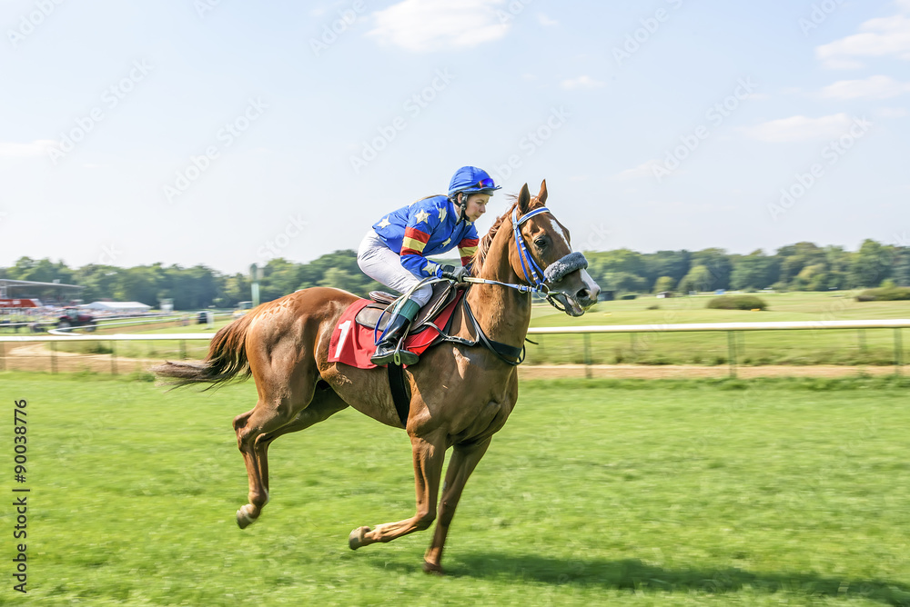 Girl jockey on red light horse